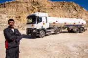 Driver posing in front of his tanker truck - Renault Trucks
